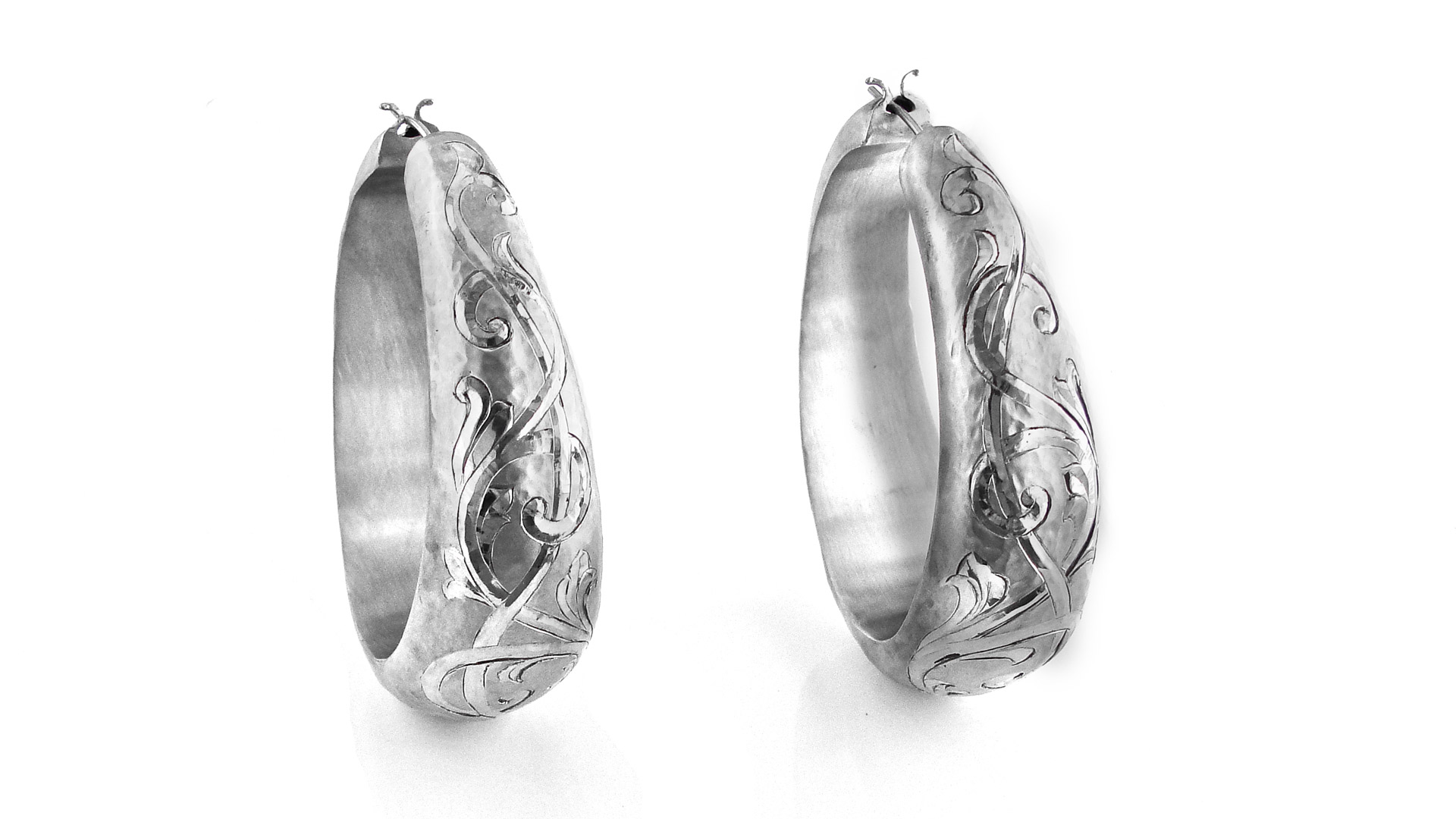 Hand forged Palladium earrings by Celeste Tracy